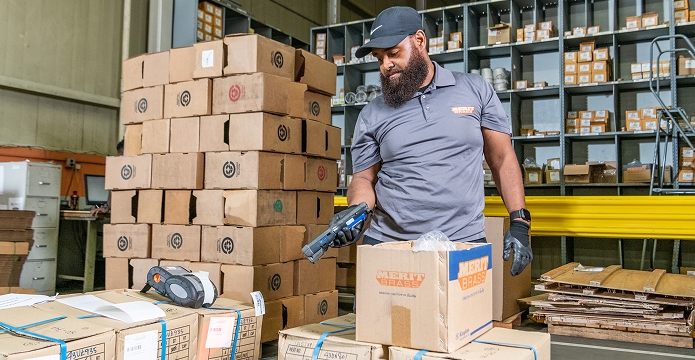 Merit Brass team member scanning PVF product for order fulfillment